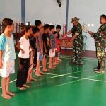 Senyum Anak Desa Warnai TMMD Satgas Bagikan Peralatan Olahraga di Gumelem Kulon